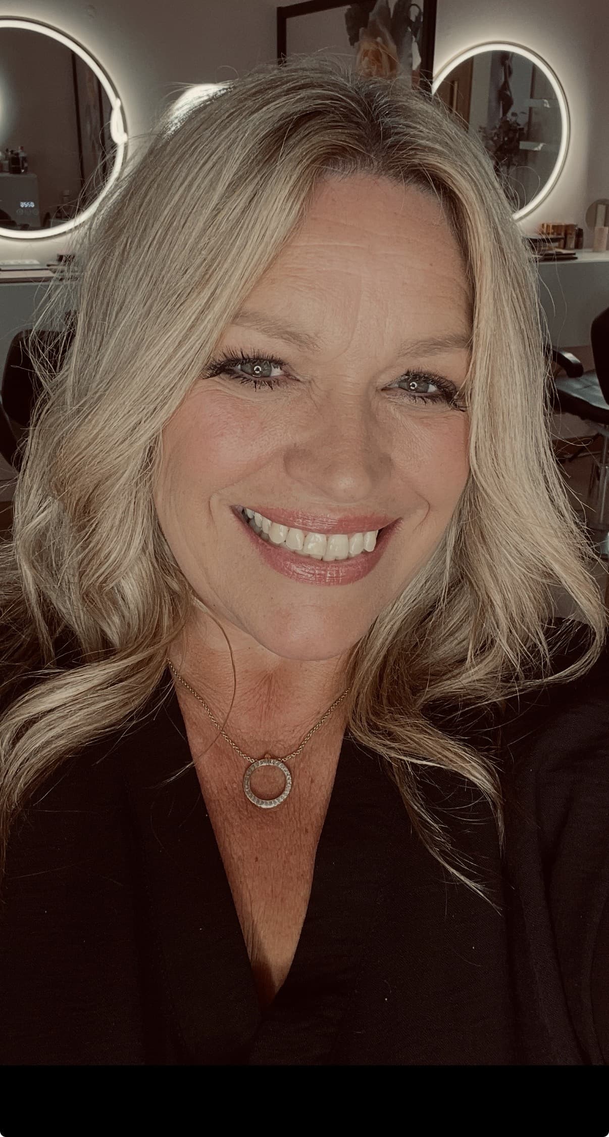 Shelley Smith smiling in professional clinic attire